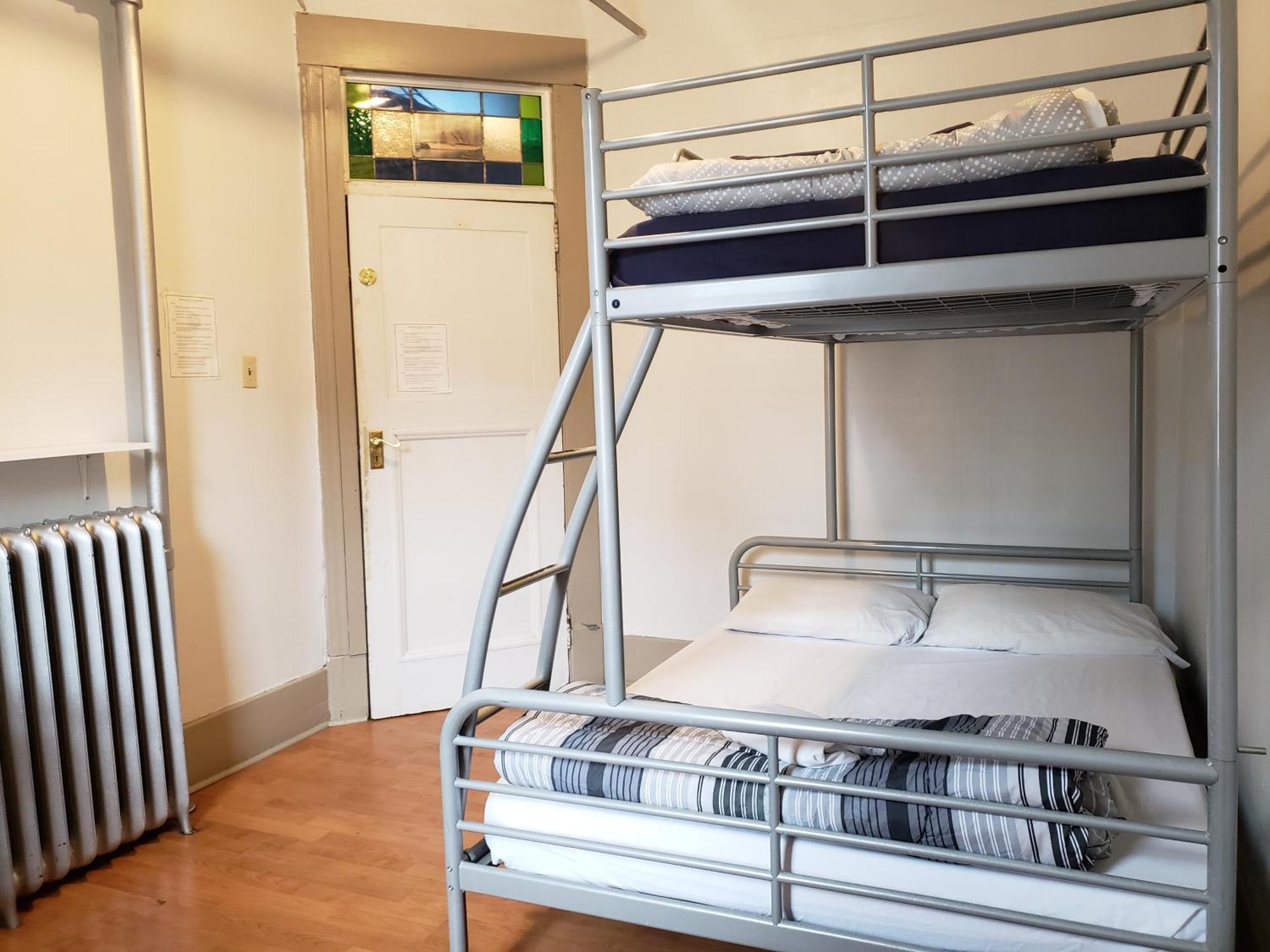 Triple Bunk with Shared Bathroom